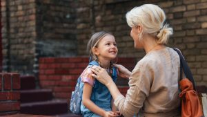mother taking daughter to school