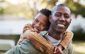 son on father's back