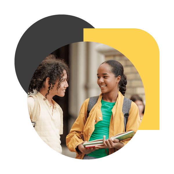 two teens talking at school