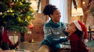 mother celebrating christmas with daughter